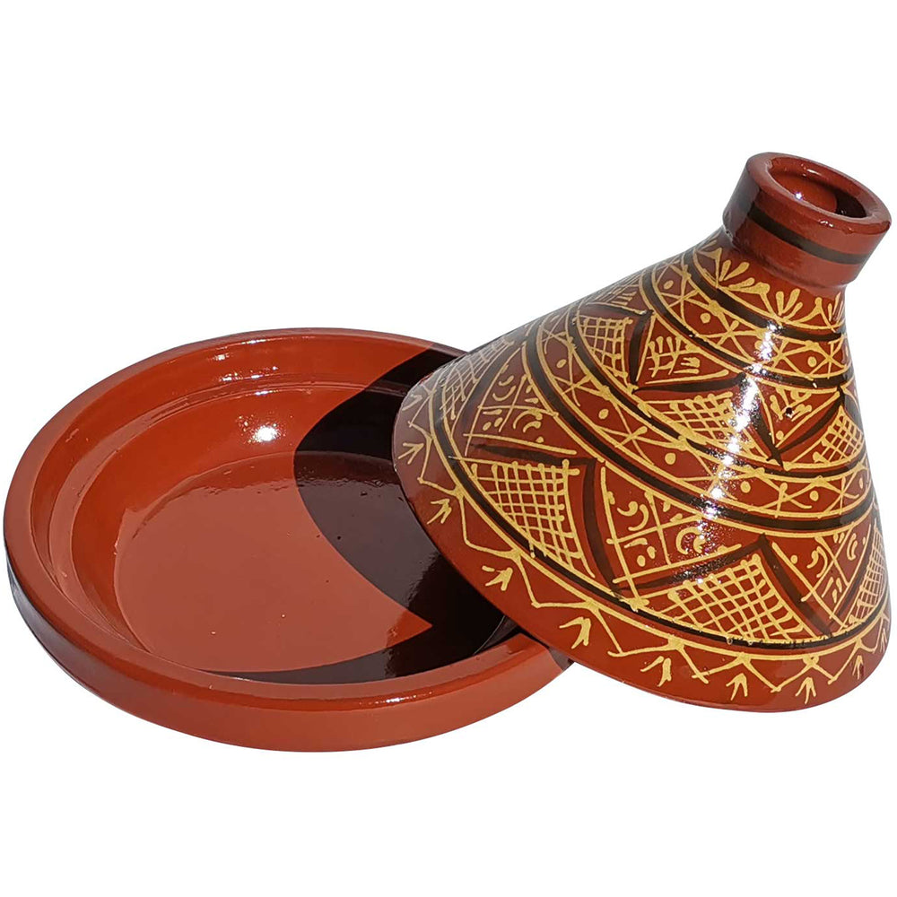 Glaserad marockansk lertagine med mönster, traditionell kokgryta för kryddrecept