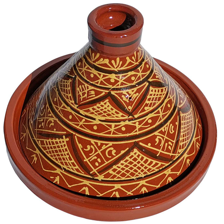 Glaserad marockansk lertagine med hennadekoration, traditionell gryta för aromatiska recept