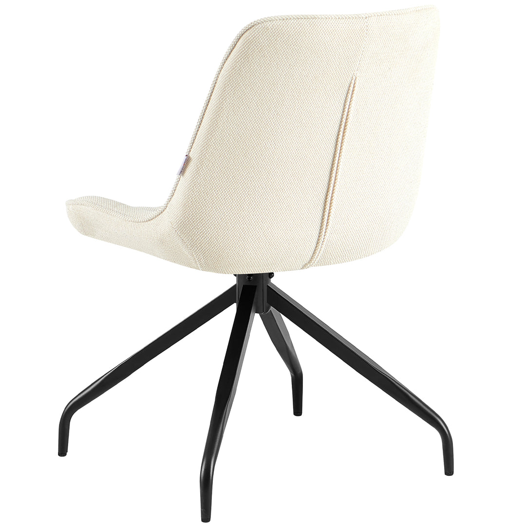 Bakifrån av den stoppade stolen, som kan vridas 360° i beige med svart metallram - elegant ryggstöd med fin struktur och tydliga linjer